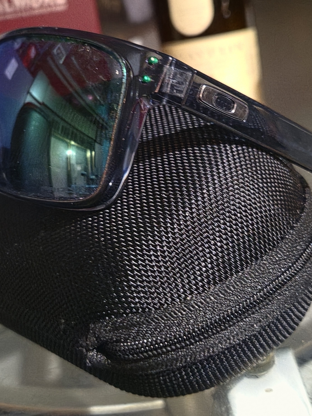 Oakley Men’s Clear Frame Sunglasses with Green Mirror Lenses
